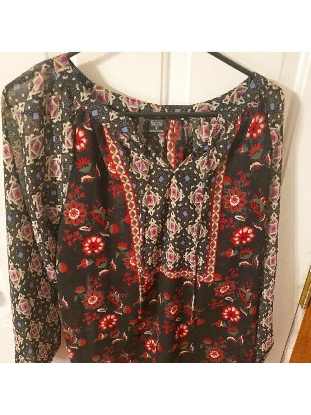 ANGIE Clothing Black/Red floral sheer blouse.